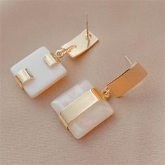 Make a statement in these earrings that will help to tie your overall look together. 0.59" W x 1.37" L 18k gold-plated copper / resin Gold Dangle Earrings, Gold Geometric, Gold Earrings Dangle, Geometric Earrings, Sensitive Ears, Pretty Jewellery, Minimalist Earrings, Organza Bags, Women's Earrings