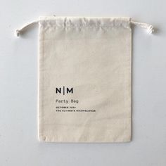 a white bag with the name nm party bag on it's front and side