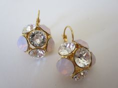 Amazing gold plated earrings placed with Swarovski Crystal and Rose Water Opal Chaton rhinestone.  These stunning earrings will be the perfect completion for a glow and unforgettable look! Holiday Sales