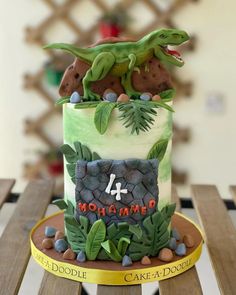 a birthday cake decorated to look like a dinosaur