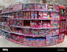 the inside of a toy store filled with barbie dolls and other toys - stock image