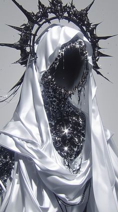 an artistic photograph of a person wearing a crown of spikes on their head and dress