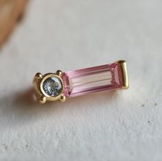 *You will receive a single tourmaline earring stud as you see from the picture. You can request to see your stones before/after placing the order. *See more earrings from this collection: https://www.etsy.com/shop/JadedDesignNYC?ref=seller-platform-mcnav§ion_id=49144957 **Ethically Sourced tourmaline, crafted with care and conscience for the conscious wearer. Each piece is handcrafted with Solid gold or silver in your choice. *Earring Size: Approximately 7mm*12mm  *Gem: Pink and blue tourmaline Luxury Tourmaline Earrings For Gift, Tourmaline Earrings Studs, Luxury Tourmaline Earrings With Gemstone Accents, Pink Tourmalibe Earrings, Garden Earrings, Luxury Multi-stone Tourmaline Earrings, Gemstone Earrings Gold, Tourmaline Earrings, Bar Studs