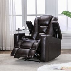 a brown recliner chair sitting on top of a rug in front of a window