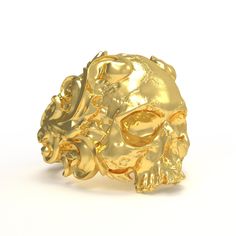 Introducing our Caesar Skull Gold Ring - a unique piece of jewelry that symbolizes the power, legacy, and the history of Julius Caesar. This ring is not just an accessory, it's a tangible connection to the world of ancient history. Our ring is skillfully crafted from high-quality gold, ensuring durability and a timeless appeal. The centerpiece of this ring is the Caesar Skull design, a symbol that captures the essence of this historic figure, representing power and legacy. This ring is more than Carved Symbolic Yellow Gold Jewelry, Yellow Gold Symbolic Carved Jewelry, Symbolic Carved Gold Jewelry, Spiritual Carved Gold Ring, Spiritual Gold Carved Rings, Collectible Gold Jewelry With Unique Design, Unique Hallmarked Skull Ring As Gift, Carved Gold Ring Jewelry, Symbolic Engraved Skull Ring Gift