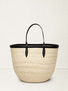 The perfect blend of style and function, The Basket is a must-have accessory for the eternal traveler. Handcrafted with care from indigenous Iraca de palma leaves, this basket is expertly woven to create a textural, round silhouette that is both eye-catching and practical. With its contrasting leather trim and slim han Canvas Leather Tote Bag, Leopard Tote, Gucci Tote Bag, Large Basket, Basket Tote, Inside Bag, Dog Canvas, Rebecca Minkoff Bag, The Medium