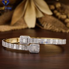 Welcome to our listing for a stunning Diamond Bracelet that will leave you truly mesmerized! We are blessed with 5000+ satisfied customer with great response. Bracelet-63 ✥ 𝐌𝐚𝐢𝐧 𝐒𝐭𝐨𝐧𝐞 𝐃𝐞𝐭𝐚𝐢𝐥𝐬 ↣ Shape : Baguette & Round Cut ↣ Type: CVD/HPHT ↣ Weight- 4.75 TDW- 234 Diamond  (0.04ct Baguette EF VS - 66 Diamond)  (0.01ct Round EF VS - 132 Diamond)  (0.01ct Round EF VS - 36 Diamond) ↣ Gold Weight ( Yellow Gold) : 10 K - 16.50 gm 14 K - 21.50 gm 18 K - 26.50 gm Comes in jewelry box  Ce Wedding Baguette Diamond Bangle, Cubic Zirconia Jubilee Cuff Bracelet For Wedding, Cubic Zirconia Cuff Bracelet For Wedding, Wedding Diamond Baguette Cut Bangle, Wedding Diamond Bangle With Baguette Cut, Wedding Bangle With Baguette Diamonds, White Baguette Diamond Tennis Bracelet For Wedding, Wedding Bangle Bracelet With Baguette Diamonds, Baguette Diamond Bangle Bracelet For Weddings