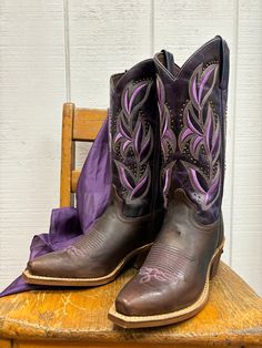 Stand out, Cowgirl! This stunning dark brown and purple women’s 12” Larissa western boot from Laredo has a snip toe, cowboy heel, and cushion comfort sole. It features beautiful western embroidered lavender leaf stitching and studs on shaft. Foot Material - Leather Shaft Height - 12” Circumference - 14” Insole - Cushion Comfort Insole Toe Shape - Snip Heel Height -1 1/4" Heel Type -Medium Cowboy Outsole -Laredo Flex Rubber Measurement taken from a size 8D - may vary by size Fitted Purple Boots With Pointed Toe, Purple Fitted Pointed Toe Boots, Fitted Purple Pointed Toe Boots, Purple Snip Toe Boots For Fall, Fitted Western Purple Boots, Fitted Purple Western Boots, Vaquera Boots, Brown And Lavender, Purple Cowboy Boots