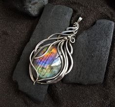 Elven style labradorite necklace with a beautiful finnish spectrolite of a beautiful rainbow color. Silver pendant - a wonderful gift to your wife, daughter, mother, sister!  * * * *  Labradorite - stone of love and fulfillment of desires! This mineral will help to discover the purpose, to show the talents inherent in nature, parents, to climb the career ladder, to fulfill the innermost desires, to find love. The product is patinated and polished. silver, labradorite Size: 5,5  cm (2.16) * * * * Iridescent Labradorite Pendant Jewelry, Iridescent Labradorite Pendant Necklace, Handmade Iridescent Labradorite Necklace, Iridescent Labradorite Necklace For Gift, Gift Iridescent Labradorite Necklace, Elven Style, Elven Necklace, Career Ladder, Rainbow Moonstone Necklace