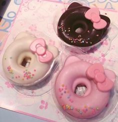 three donuts with hello kitty designs on them