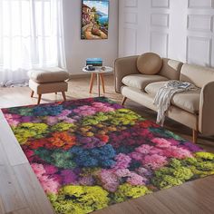 a living room filled with furniture and a colorful rug