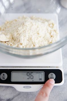 a digital scale with flour on top of it