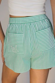 Our Boxer Shorts are the perfect piece for your summer wardrobe. The stripe is an instant classic, and the soft cotton make these comfortable and easy. Pair it back to our embroidered Diksha Button Down. Green Bottoms With Vertical Stripes For Summer, Green Vertical Stripes Bottoms For Summer, Cotton Relaxed Fit Shorts With Vertical Stripes, Casual Cotton Shorts With Vertical Stripes, Casual Cotton Vertical Stripes Shorts, Cotton Bottoms With Vertical Stripes, Short, Cotton Bottoms With Vertical Stripes, Short Cotton Bottoms With Vertical Stripes, Summer Cotton Bottoms With Striped Hem