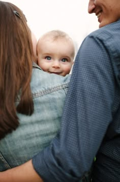 a woman holding a baby in her arms