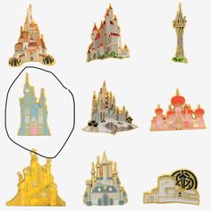 a collection of disney pin's including castle pins and brooches, all in different colors