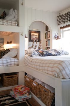 a bedroom with bunk beds and baskets on the floor