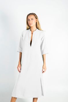 "This carefully tailored women's midi dress is made of cool and light pure linen. It's a stylish outfit for women with distinct taste, for any occasion. NO BUTTONS, NO BUTTONHOLES, NO ZIPS. ZERO SHRINKAGE FITTING: The model appearing in the photo is 176cm (5' 9\") tall and features an S size dress. SMALL Bust (all-around) 111cm/ 43.7\" Waist (all-around) 103cm/ 40.5\" Hips (all-around) 111cm/ 43.7\" Length 120cm/ 47.2\" MEDIUM Bust (all-around) 118cm/ 46.5\" Waist (all-around) 110cm/ 43.5\" Hips Classic Linen Summer Dress, Elegant Linen Tunic Dress For Daywear, Elegant Tunic Linen Dress For Daywear, Elegant Flax Colored Linen Day Dress, White Linen Short Sleeve Dress For Work, Elegant Flax Linen Dress, Elegant Linen Dress For Daywear, Elegant Linen Dress For Beach, Elegant Linen Tunic Dress