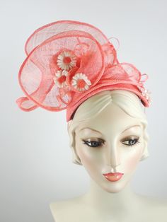 This women's peach/coral fascinator hat is a sure bet for Kentucky Derby or Kentucky Oaks. Or any summer event really, like church, ladies tea, or just for fun. It is made with sinamay straw and is very light and airy. The hand sculpted sinamay sits atop a handmade bandeau base and is secured with an elastic band that goes behind the ears and head to keep the hat in place. It is topped with vintage daisies and hand rolled sinamay leaves as well as sinamay swirls for added texture. An inner grosg Kentucky Oaks, Mother Of The Bride Hats, Ladies Tea, Custom Made Hats, Sinamay Fascinator, Handmade Hats, Bridal Hat, Ribbon Headbands, Kentucky Derby Hats