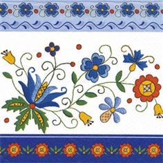 a blue and white table cloth with flowers on it's border, in the middle of which is an embroidered design