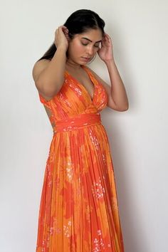 Yellow and orange ruched maxi dress with floral and leaf print. - Aza Fashions Orange V-neck Maxi Dress For Cocktail, Orange Halter Neck Dress For Cocktail, Orange Halter Neck Maxi Dress For Evening, Orange Floor-length Spring Dress, Orange Summer Maxi Dress For Evening, Orange Evening Maxi Dress, Orange Maxi Dress For Summer Evenings, Elegant Orange Halter Neck Maxi Dress, Fitted Orange Ruched Maxi Dress