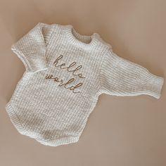 About Our beautiful cosy 'Hello World' Chunky Knit Romper is the cutest debut piece for your little love.  Made with a beautiful soft cotton, this cosy knit is a must have piece to add to your little ones capsule wardrobe. A heirloom piece designed to last for years to come. Featuring snap buttons on the neck for easy changing. Available in our 'Honey' colourway in sizes NB and 0-3M. This is the Romper only. Complete the look with our matching Chunky Knit Beanie & Booties. Please refer to our si Baby Trends, Knit Items, Knit Romper, Hospital Outfit, Newborn Hospital, Knitted Romper, Hello World, Cozy Knit