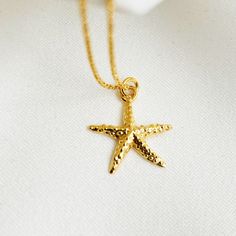 "This is wonderful GOLD STARFISH NECKLACE,  The perfect Personalized Beach jewelry to wear everyday , you can  add a simple touch to your look , its perfect for summer, beautifull  detailing on both front and back. Great gift for all Sea Life lovers. ♡ DETAILS  Necklace length : please choose Pendant  : 1.5 cm- 0.59\" Material: 24k gold plated sterling silver 925 Please note that the chain may vary slightly from the ones shown above. ♡ PERSONALISATION How about adding one of my crystal birthston Gold Starfish Charm Jewelry, Gold Necklace With Starfish Charm For Gift, Gold Nautical Jewelry With Star Charm, Ocean-inspired Gold Jewelry With Star Charm, Starfish Charm Necklace Perfect For Gifts, Starfish Charm Necklace As Gift, Starfish Charm Necklaces For Gifts, Starfish Charm Necklaces As Gift, Gold Starfish Necklace With Lobster Clasp