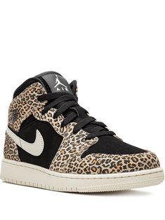 the nike air jordan leopard print sneaker is available in black, white and brown