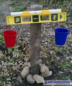 two buckets are attached to a tree with three different balance scale