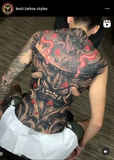 a man with a tattoo on his back