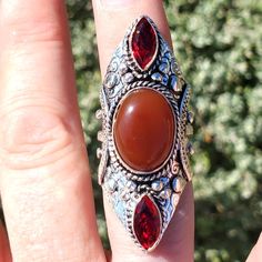 Brand New Handmade Carnelian And Garnet Silver Statement Ring. Size 7 925 Stamped New To Poshmark? Use Referral Code Kimberlyn222 To Receive $10. Bohemian Amber Sterling Silver Rings, Bohemian Amber Jewelry With Gemstone Accents, Bohemian Red Jewelry With Gemstone Accents, Bohemian Sterling Silver Ruby Ring, Handmade Bohemian Carnelian Ring, Bohemian Handmade Carnelian Rings, Bohemian Carnelian Round Rings, Bohemian Amber Rings As Gift, Bohemian Amber Rings For Gift