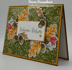 a close up of a card with leaves and acorns on it, which reads autumn wishes