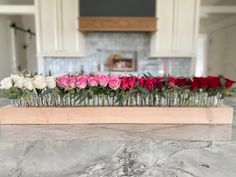 a bunch of flowers sitting on top of a counter