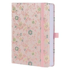 a pink notebook with floral print on the front, and a ribbon around the cover