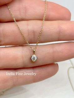 Stunning 1/4 Carat Natural Diamond Bezel Pendant. Comes with an adjustable 14k Cable Necklace, pendant can be worn at 16 or 18 inches, great to stack. Measurements: 9.04 x 4.80 millimeters Comes set with Qty 1 , 4.00 mm Round Diamond Diamond Color G+ Diamond Clarity I1+ Chain Length 16-18 inches Closure type : Lobster Clasp 14k Gold Necklace With Prong Setting, 14k Gold Round Necklaces With Prong Setting, 14k Gold Necklaces With Prong Setting, 14k Gold Solitaire Necklace For Everyday, Adjustable Yellow Gold Diamond Necklace Gift, Everyday 14k Gold Solitaire Necklace, 14k Gold Necklace With Prong-set Round Pendant, Round Solitaire Necklace In 14k Gold As A Gift, 14k Gold Round Solitaire Necklace As A Gift