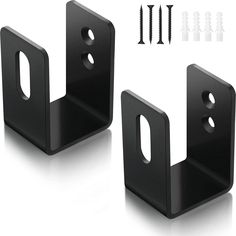 two black metal brackets with screws on them