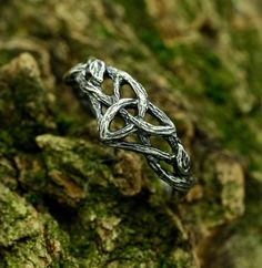 Handcrafted from sterling silver, our Fantasy Braided Tree Engagement Ring with Knot Twig Leaf is an enchanting and unusual piece inspired by the beauty of nature. Featuring a unique tree engagement design with intricate twig leaf details, this silver ring is a perfect choice for those seeking witchy jewelry with a touch of dark fairy aesthetics. A distinctive and plant-themed jewelry gift for a woman who appreciates the extraordinary. Characteristics: Metal - Recycled solid sterling silver  Fin Engagement Rings Witchy, Elvish Style Silver Ring For Gift, Symbolic Silver Jewelry For Weddings, Symbolic Silver Jewelry For Wedding, Witchy Rings, Nature Rings, Witchy Engagement Ring, Vine Wedding Ring, Celtic Rings Women