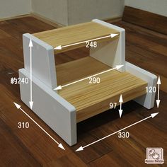 the step stool is made out of wood and has three levels to fit into it