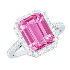 a pink tourmaline and diamond ring in white gold with diamonds on the sides