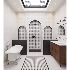 a bathroom with a skylight above the bathtub