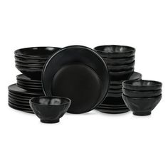 black dinnerware is stacked on top of each other