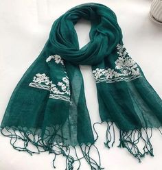 D E S C R I P T I O N : Gorgeous embroidery linen scarves in a beautiful emerald green shade. Made from pure linen, these scarves are not only great on the skin with all-natural materials but kind to the skin also.  Printed with an array of eye-catching colours to enhance and compliment any outfit. Beautifully embroidered with white soft thread.  A must-have a piece in any woman's wardrobe.  Wash with lukewarm water and they will get softer as you wash.  Size: 160x55cm approx G I F T : Please fe Elegant Green Embroidered Shawl, Bohemian Embroidered Green Dupatta, Green Embroidered Bohemian Shawl, Embroidered Green Spring Dupatta, Embroidered Green Dupatta For Spring, Green Embroidered Dupatta For Spring, Green Bohemian Dupatta With Floral Embroidery, Bohemian Green Dupatta With Floral Embroidery, Green Bohemian Dupatta Scarf