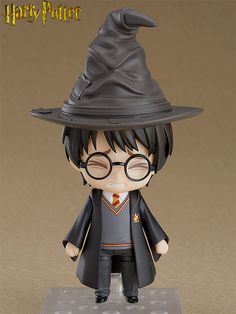 a harry potter figurine is shown on a stand with glasses and a hat