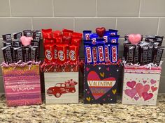 valentine's day treat bags with chocolates and candies in them on a counter