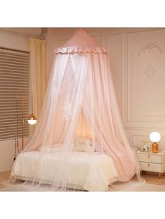 a bed with a pink canopy over it