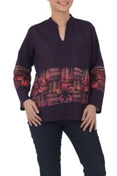 Made from 100% cotton voile this exotic blouse features a hand-painted batik design by Chomsuda Samana of Thailand. Rich purple in color the comfortable lightweight tunic has a tie-dyed pink floral and striped pattern highlighting the motifs long sleeves and an open mandarin collar. Batik Ideas, Batik Blouse, Spirit Clothing, Fair Trade Clothing, Batik Design, Batik Pattern, Rich Purple, Hair Fragrance, Cotton Voile