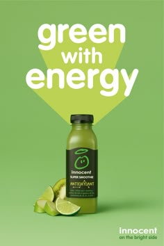 a bottle of green juice next to sliced limes on a green background with the words, green with energy