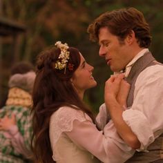 a man and woman dressed in period clothing dance together on the set of pride, which is based on shakespeare's play