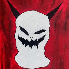 a painting of a white demon with horns and fangs on it's face is shown