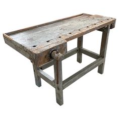 an old wooden table with wheels attached to it's top and bottom legs, against a white background