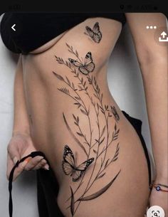 a woman's stomach with butterflies on it